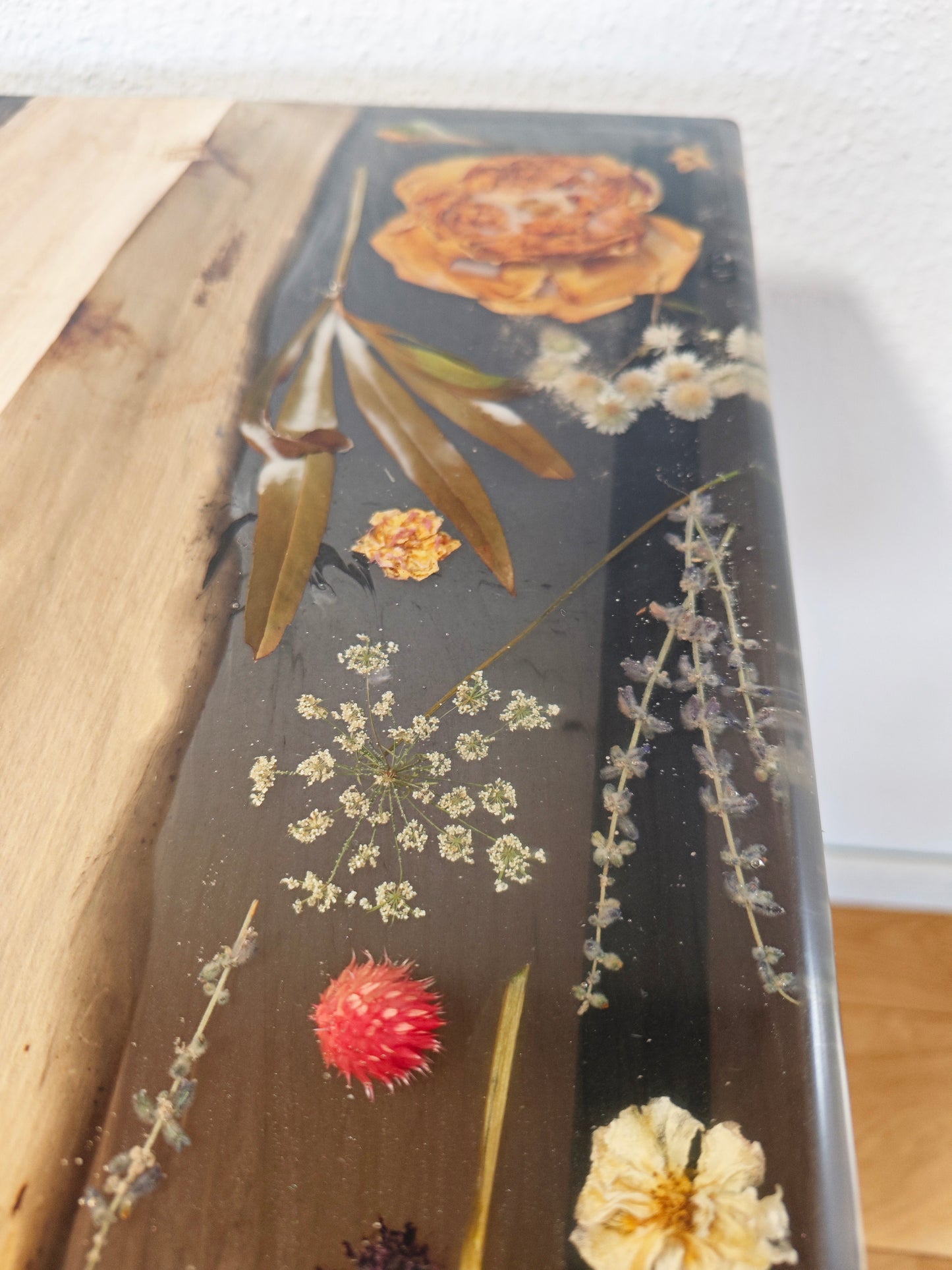 Side table made of walnut wood and black epoxy resin