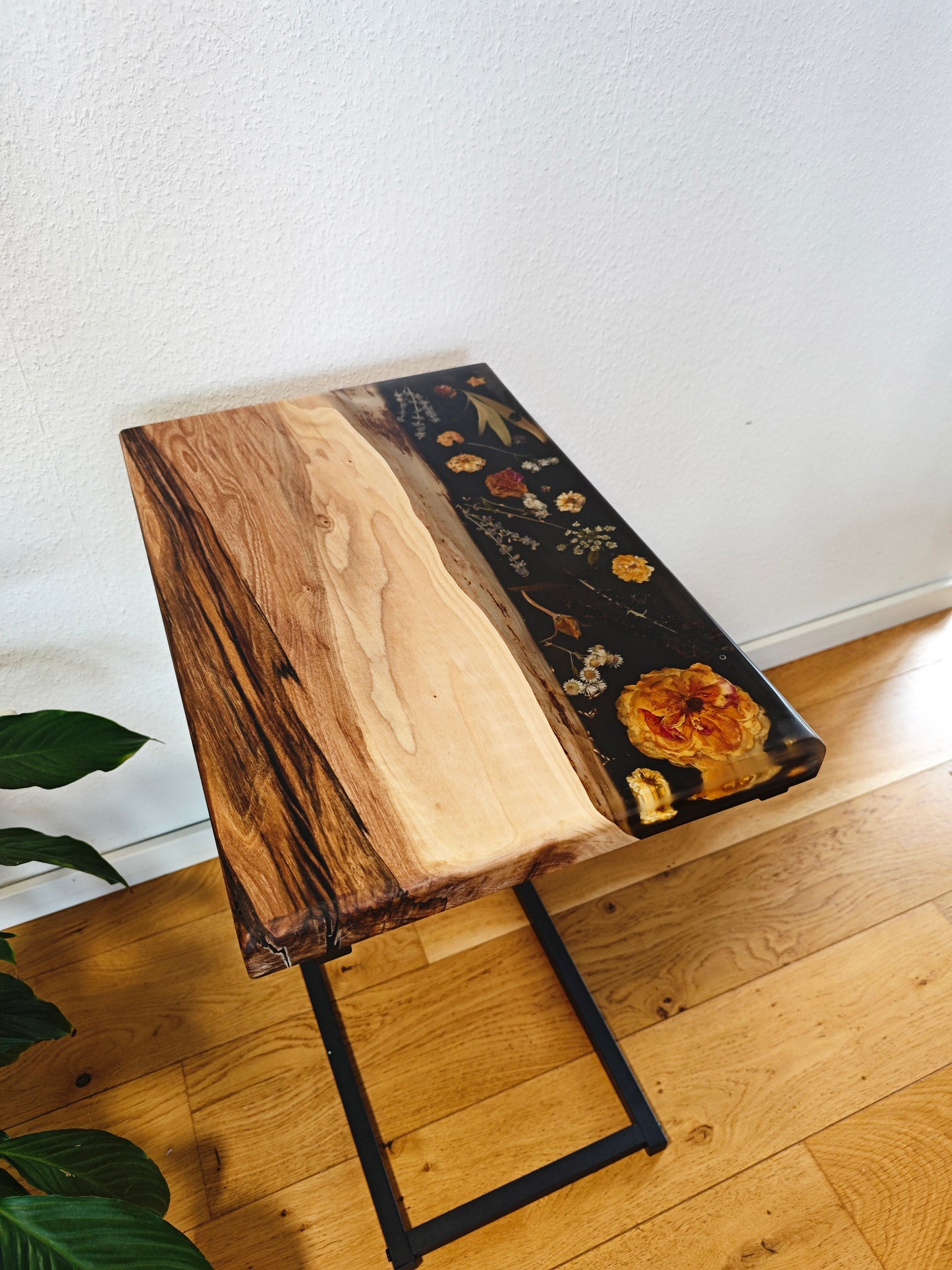 Side table made of walnut wood and black epoxy resin