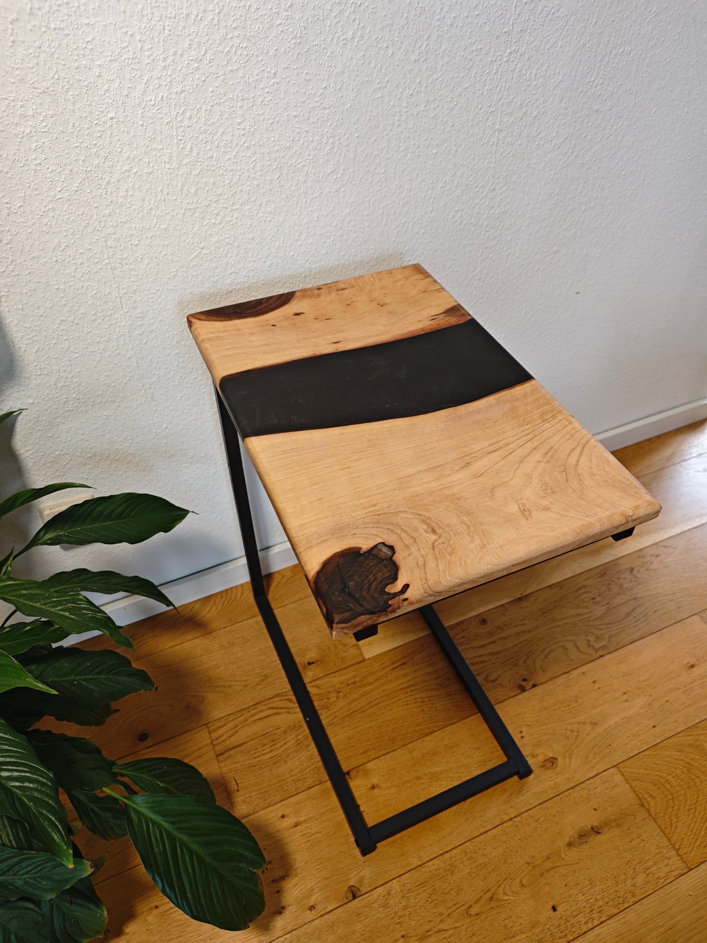 Side table made of walnut wood and black epoxy resin