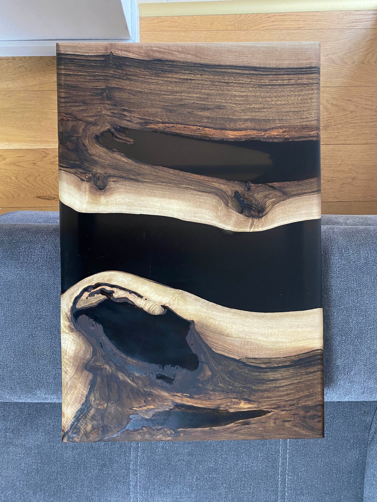 Side table made of walnut wood and black epoxy resin